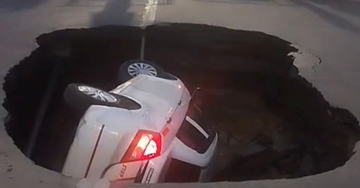 cab falls in sinkhole