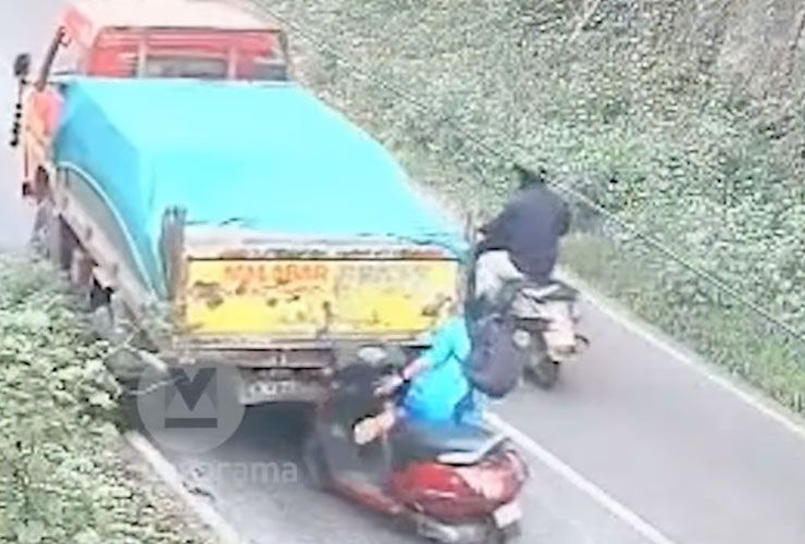 woman on scooter escapes getting crushed by dumper truck