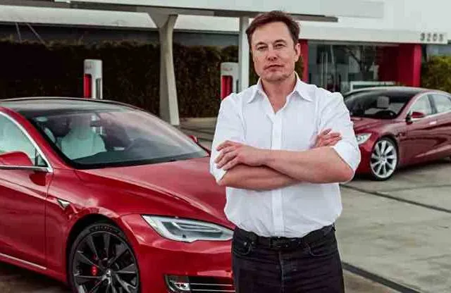 Tesla CEO Elon Musk with his cars