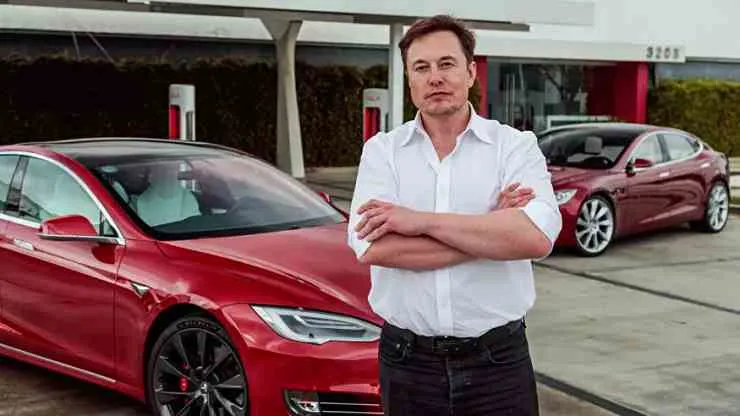 Tesla CEO Elon Musk with his cars