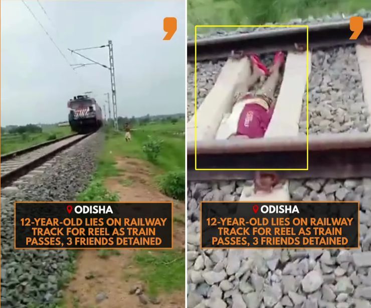 boy lies on railway track