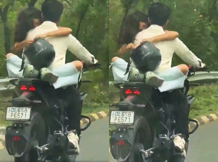 couple hugging on bike 