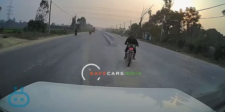 idiot biker crashes into bolero