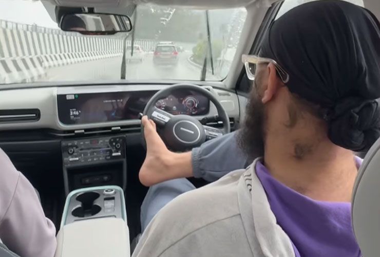 influencer driving hyundai creta ev with feet
