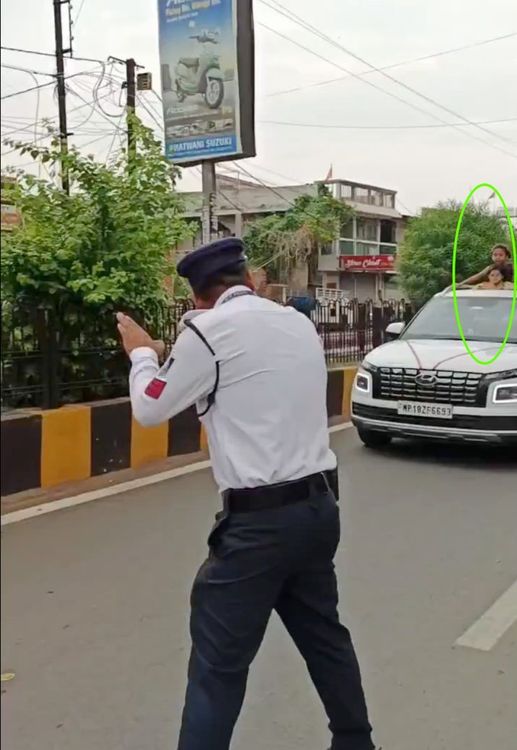cop stops car with kids out of sunroof
