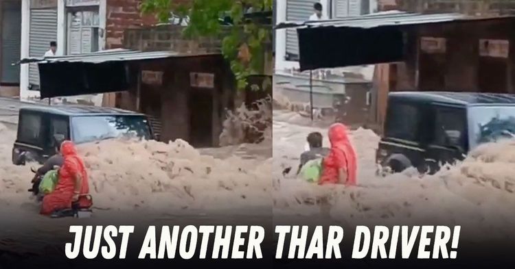 mahindra thar knocks down biker on flooded road mahindra thar knocks down biker on flooded road