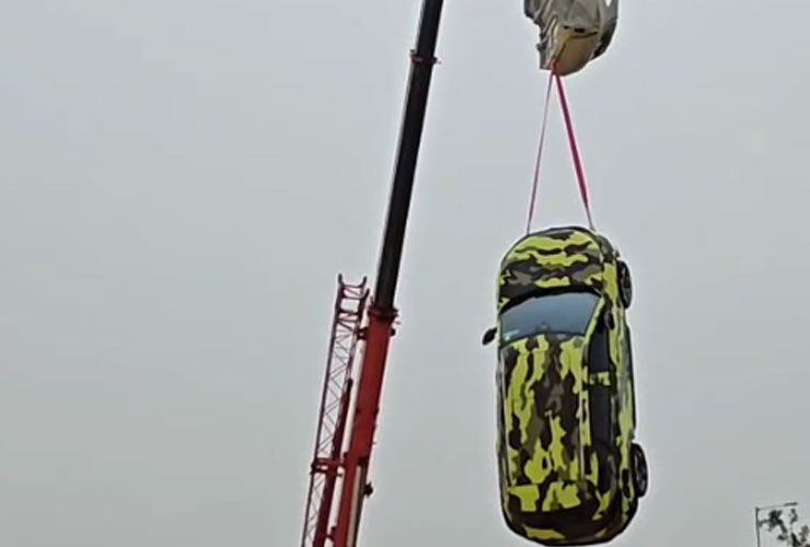 tata harrier ev hanging from a crane